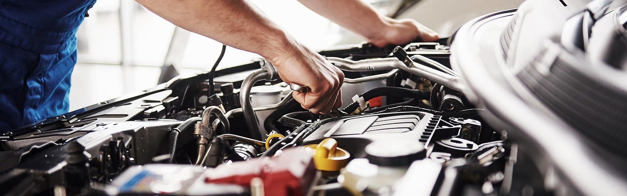 Technician working on an engine